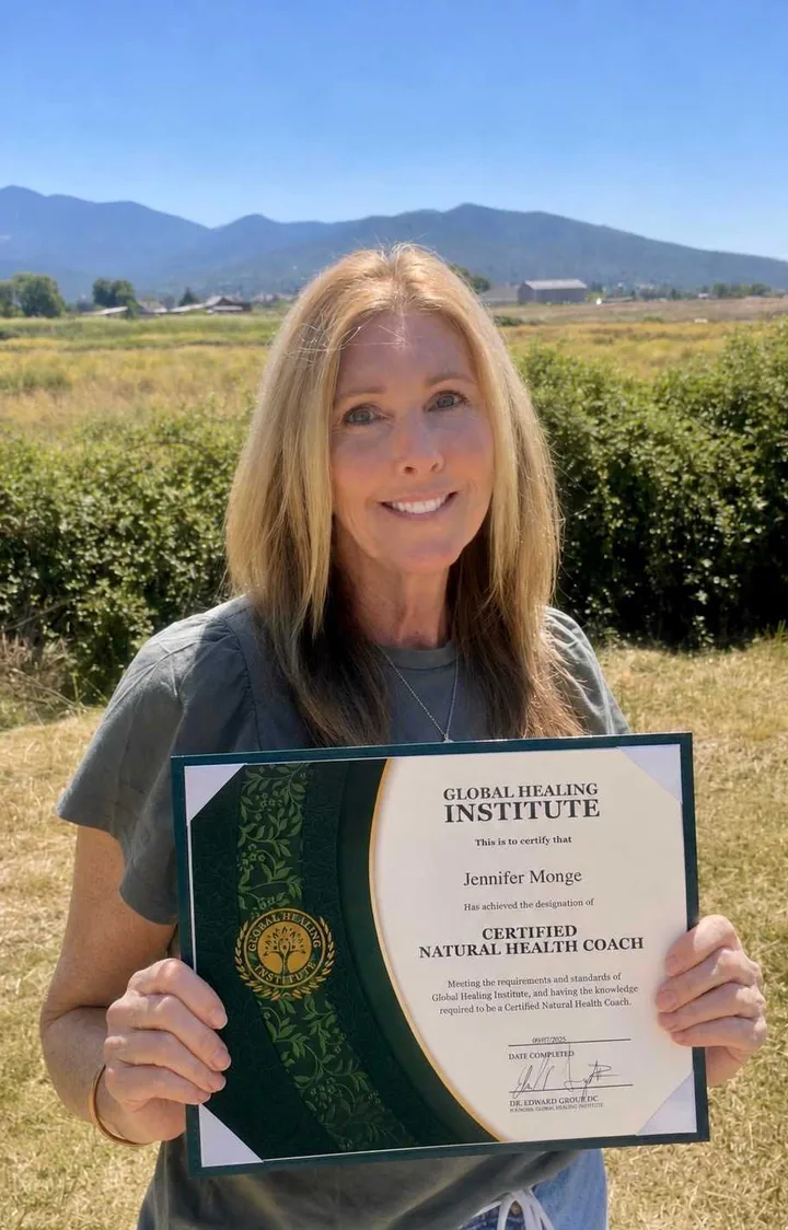 Jasiel Monge holding her Global Healing Institute Certified Natural Health Coach certificate